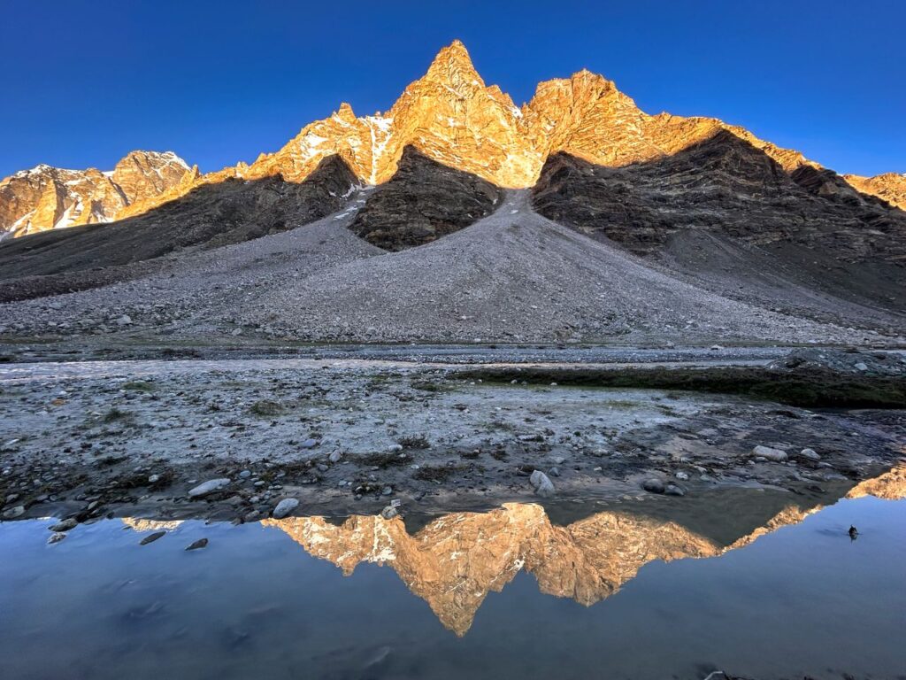 Stunning mountain reflection captured at dawn in the scenic Zanskar region.